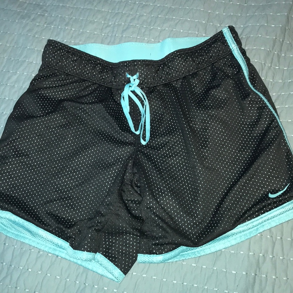 Blue and black Nike athletic shorts